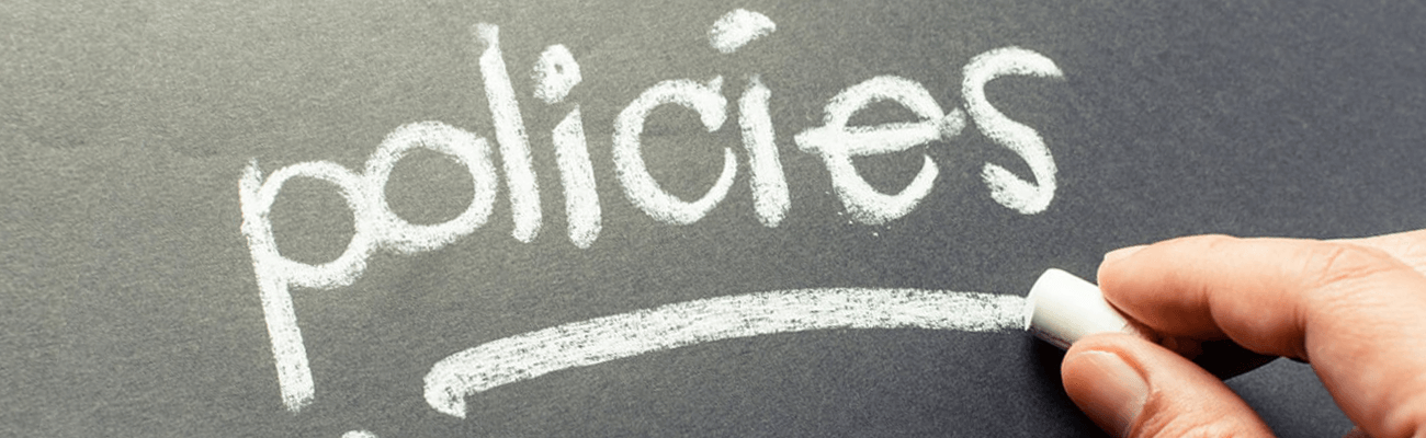 policies written on a blackboard