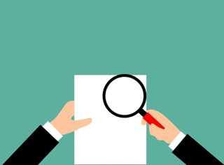 Document with magnifying glass